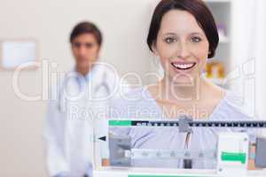 Smiling woman on the scale