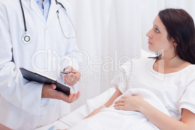 Female patient getting examination results explained