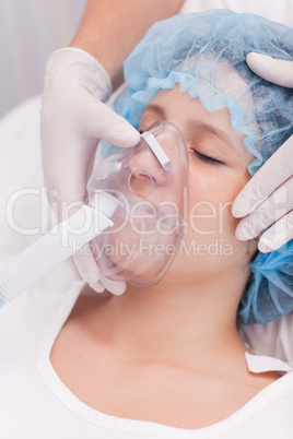 Female patient with oxygen mask