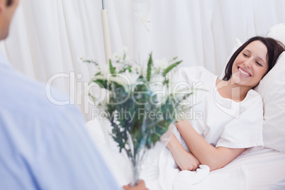 Woman getting visited in hospital