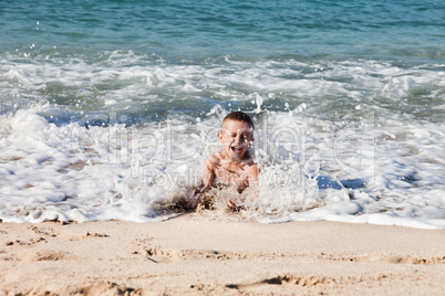 Child boy on sea beach