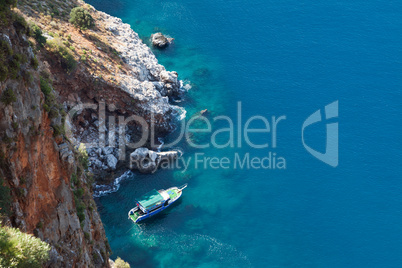 Diving ship at blue sea mountain beach bay