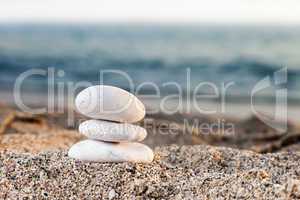 Stack or pile of balancing stones on sea beach