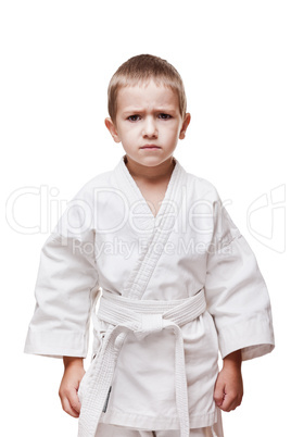 Child boy in kimono training karate