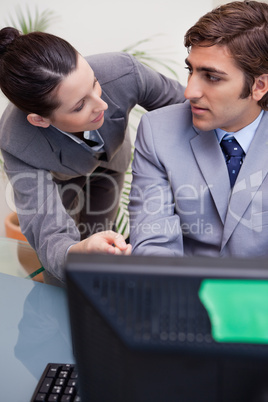 Businessman listening to his colleagues explanation