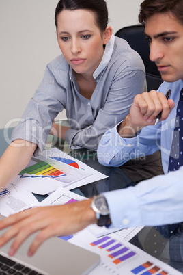 Business team analyzing charts together