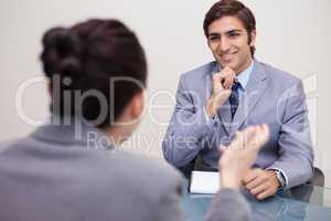 Smiling businessman in a negotiation