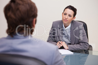 Businesswoman listening to her business partner