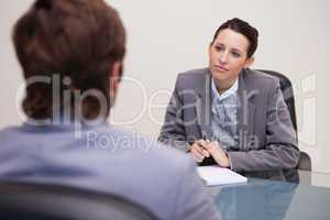 Businesswoman listening to her business partner