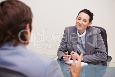 Smiling businesswoman in a meeting