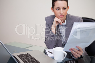 Businesswoman reading contract