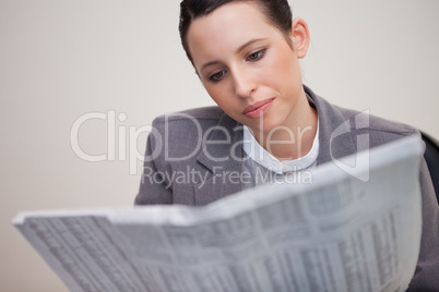 Businesswoman reading stock report