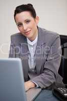 Businesswoman working at her desk