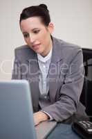 Businesswoman working on her laptop