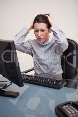 Businesswoman having problems with her computer