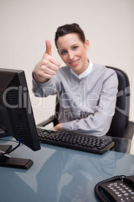 Thumb up given by businesswoman