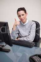 Businesswoman giving thumb up