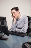 Businesswoman waiting patiently for her pc to work