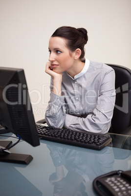 Businesswoman daydreaming at workplace