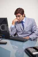 Businessman waiting for his computer to work