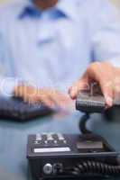 Telephone being hung up by businessman