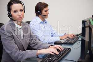 Side view of working call center agents