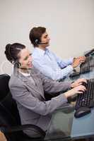 Side view of call center agents doing their work