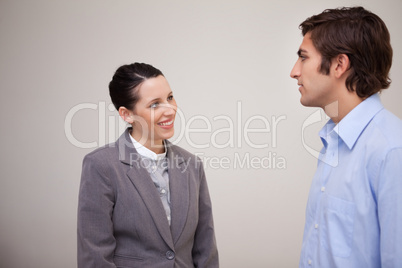 Businesswoman smiling at her colleague