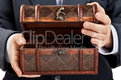 Hand holding treasure chest