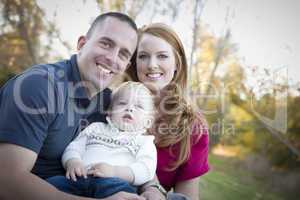 Young Attractive Parents and Child Portrait Outside