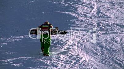 boarder walking on snow