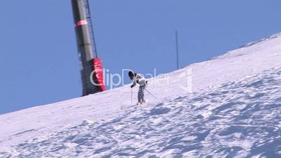 Woman skiing extreme on beautiful sunny day