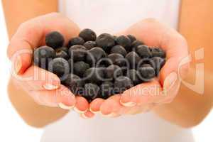 blueberries in the hands of a woman