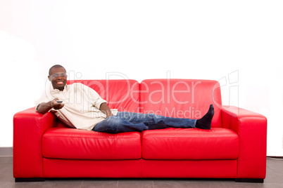 man on the sofa with remote control