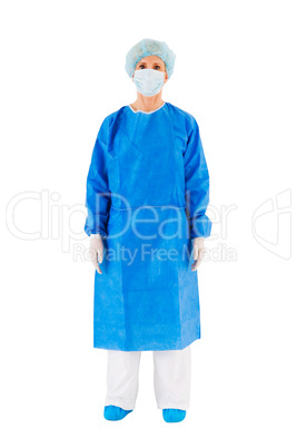 female surgeon standing with coat hat and mask