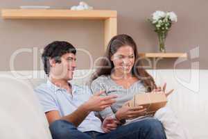 Couple on the sofa with parcel