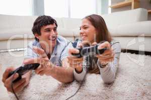 Happy couple playing video games together