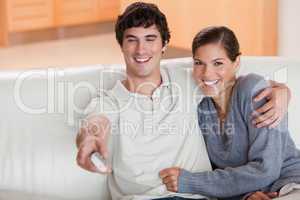 Couple watching television on the couch