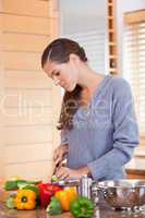 Woman in the kitchen preparing vegetables