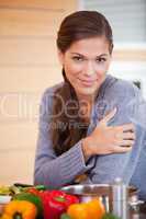 Woman leaning against the kitchen counter