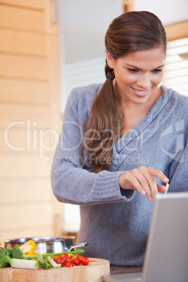 Woman looking up a recipe on the internet