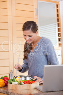 Woman stirring the meal she is preparing