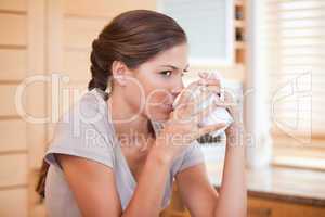 Side view of woman enjoying coffee