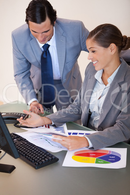 Business people working on diagrams together