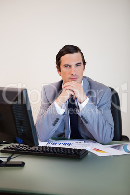 Businessman sitting behind his desk