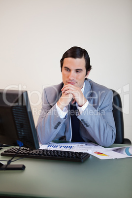 Businessman waiting for his pc