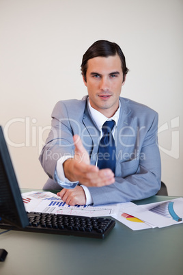 Businessman offering his hand