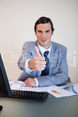Thumb up given by businessman