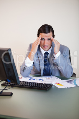 Businessman experiencing a headache