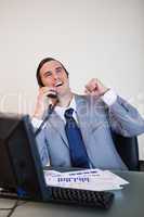 Cheerful businessman on the phone